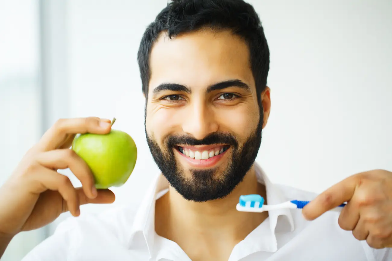 beautiful smiling man brushing healthy white teeth 2023 11 27 05 10 03 utc